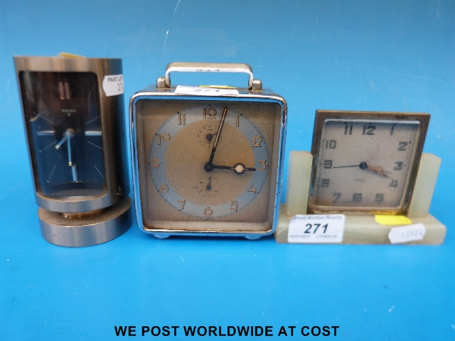 Three metal cased vintage alarm clocks, one chromium plated square example, one Deco on a marble