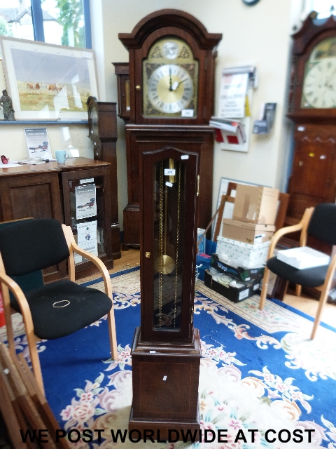 A contemporary grandmother longcase clock with strike and Westminster chimes in mahogany case with