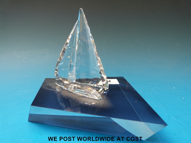 Swarovski sailing boat and display stand, all in original boxes.