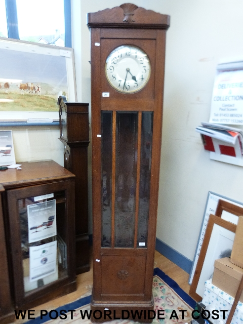 A oak cased long case clock