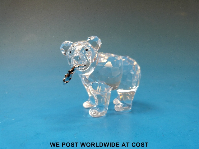 Swarovski bear with salmon, all in original boxes.