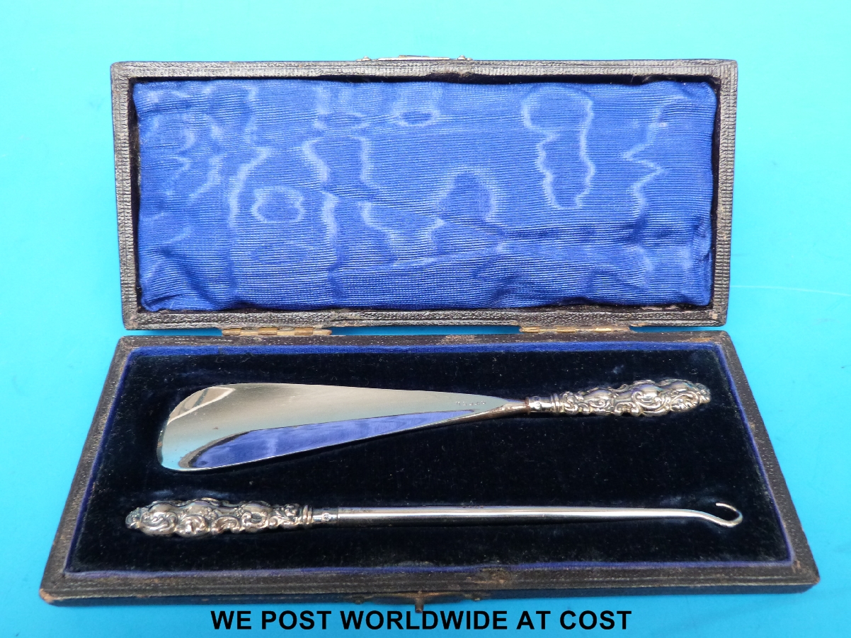 Silver cased button hook and shoe horn.