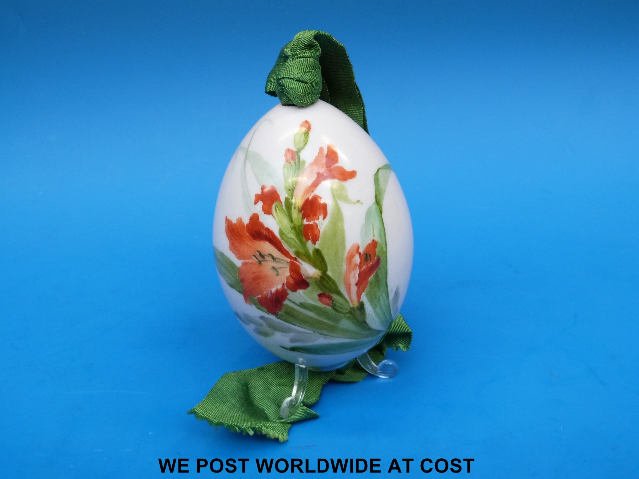 A Russian porcelain Easter egg painted with gladioli, Imperial Porcelain Factory c1890 (10cm)