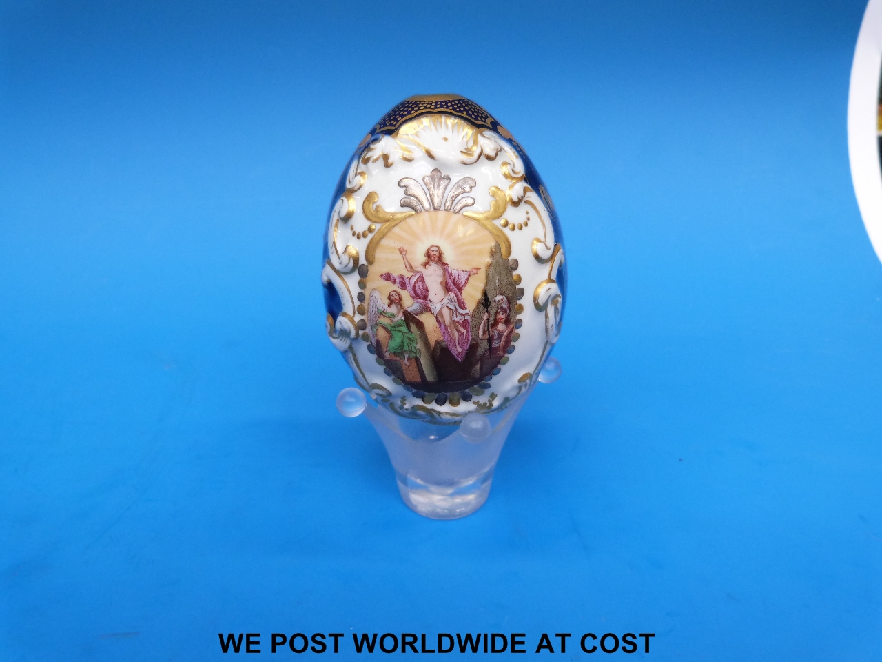 A 19thC Russian porcelain relief moulded Easter egg with the resurrection of Christ painted to one