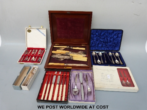 A mahogany cased canteen in two sections containing fish cutlery and other cased and boxed cutlery.