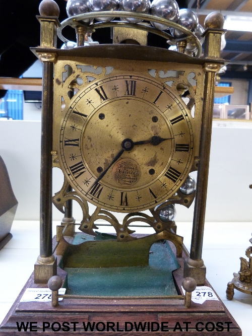 A brass skeleton clock, ball bearing driven with Harding and Bazeley Cheltenham to dial