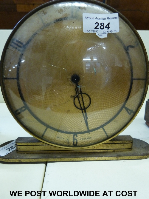 Art Deco Smiths clock with engine turned brass dial and Arabic numerals.