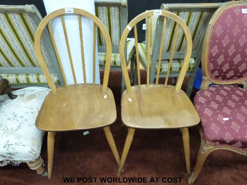 A pair of lightwood Ercol dining chairs (bentwood and stick-backed)