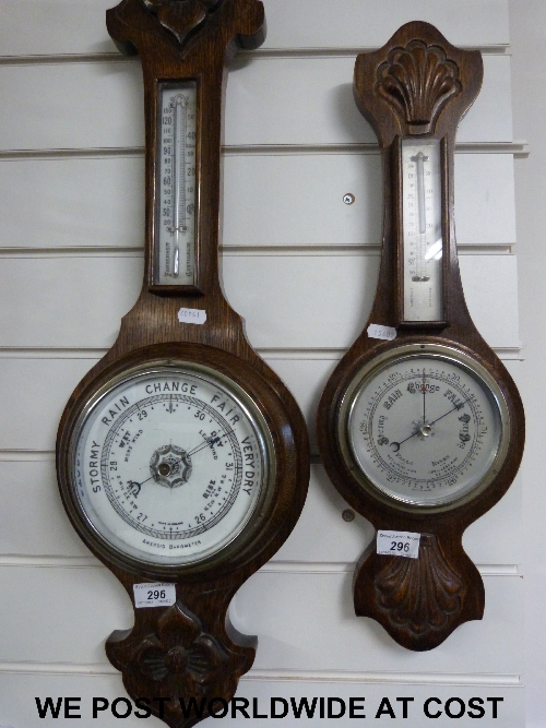 Two Aneroid barometers in oak cases