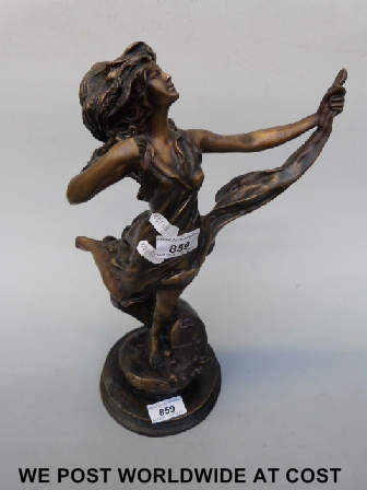A bronze figure of a dancing lady.