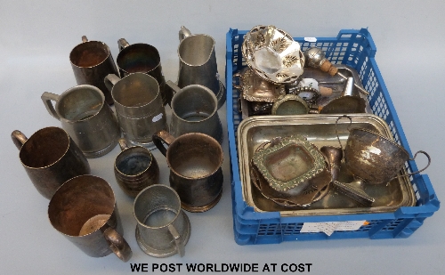 A selection of silver plate and pewter items including a sporting trophy, tankards etc.