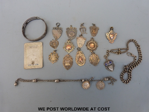 A quantity of silver fobs, albert, unmarked chatelaine and an Egyptian bracelet. Approx 170g all in