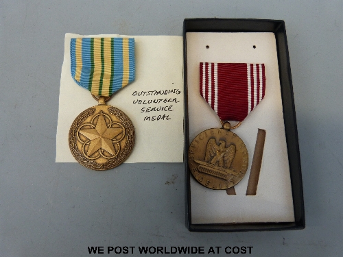 US Army 'Outstanding Volunteer Service' medal and 'Good Conduct' discharge medal.