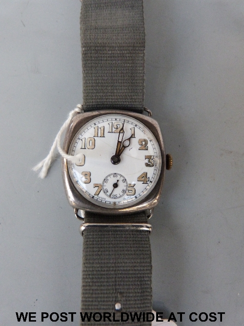 Silver cushion shaped wristwatch c1920 with wire lugs, white dial luminous numerals and hands, sub