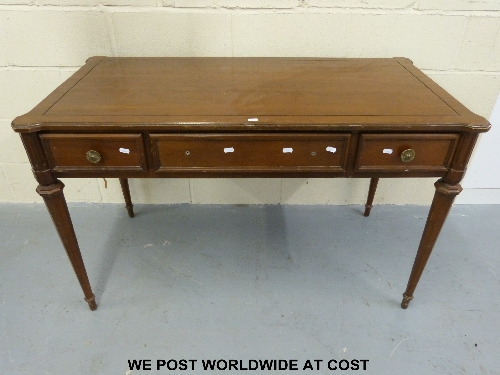 Walnut three drawer table.