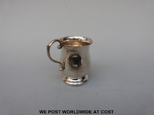 A white metal christening mug, approx 70 g.
