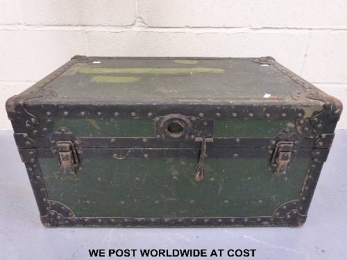 A substantial, heavy metal trunk with riveted binding together with an oak hall mirror