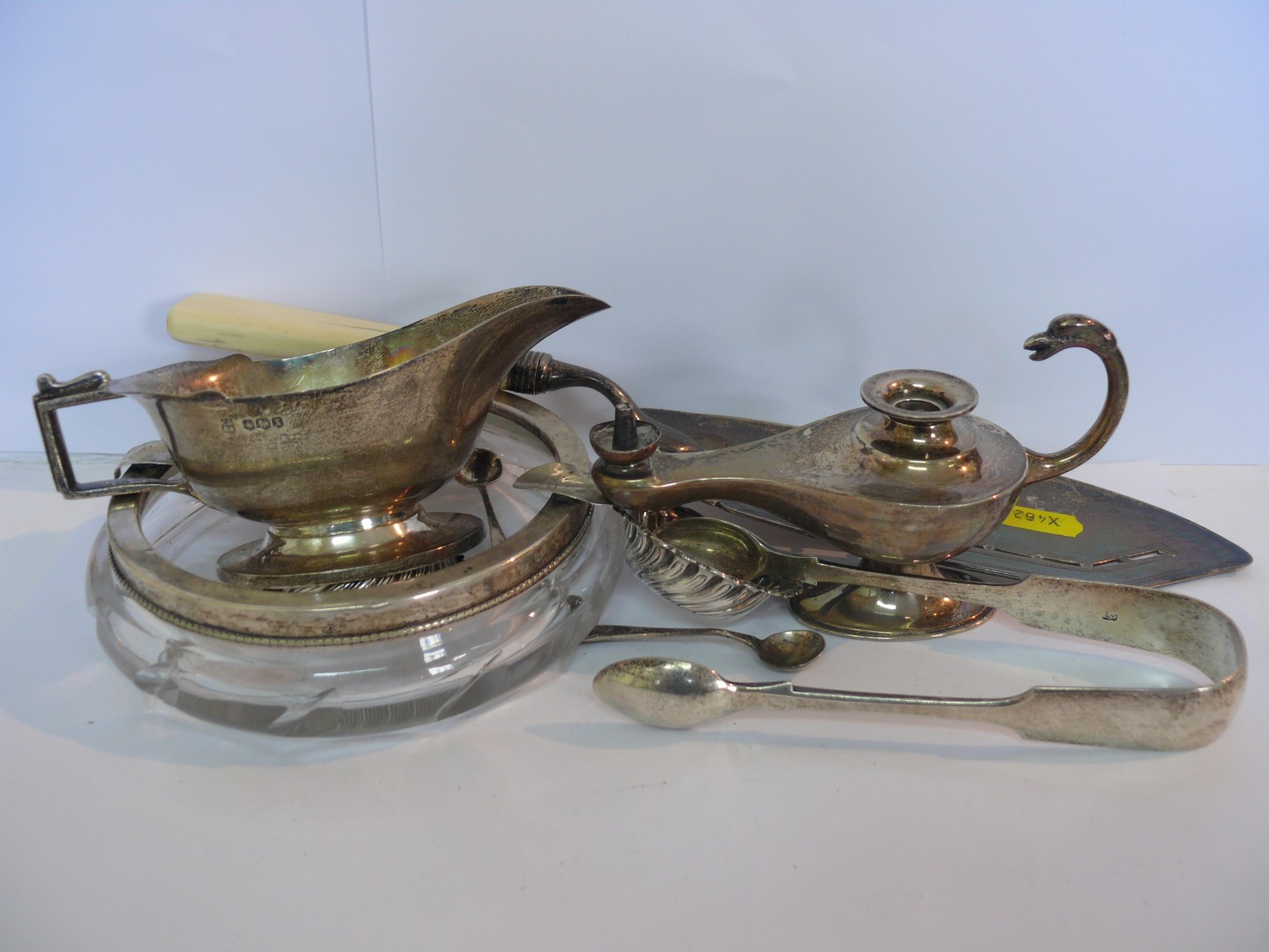 A silver sauce boat by Charles Boyton & Son, Sheffield 1940; together with a pair of silver sugar