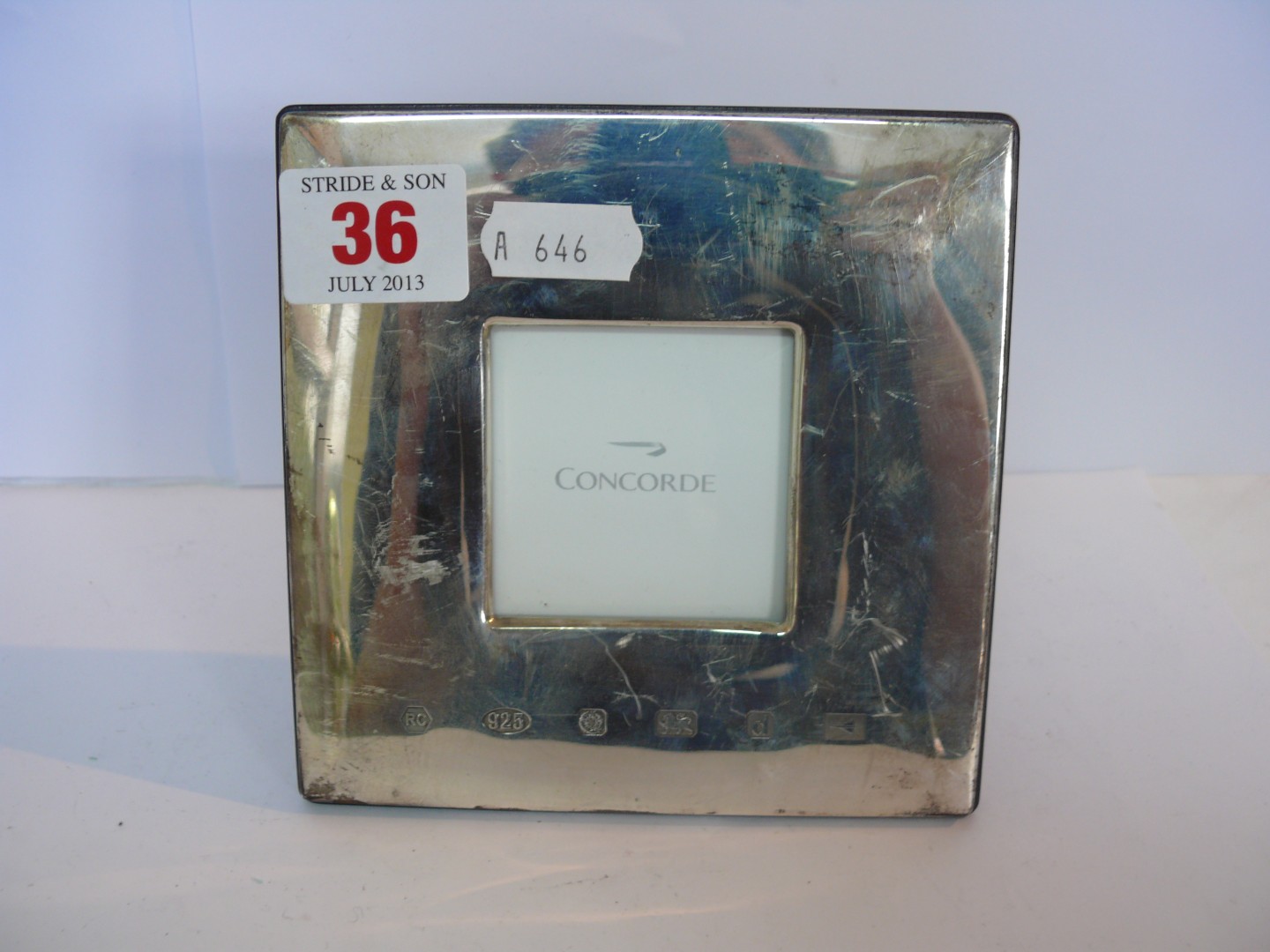 A square silver Concorde photograph frame, maker Carrs of Sheffield, 2000, 12 x 12cm.