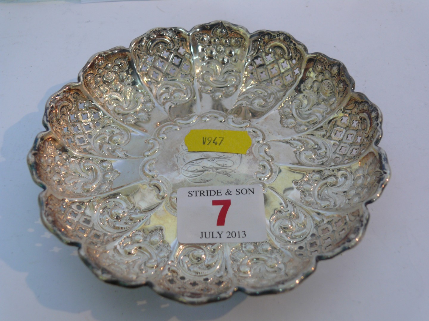 A Victorian silver pierced circular dish, having floral and scroll decoration, engraved initials