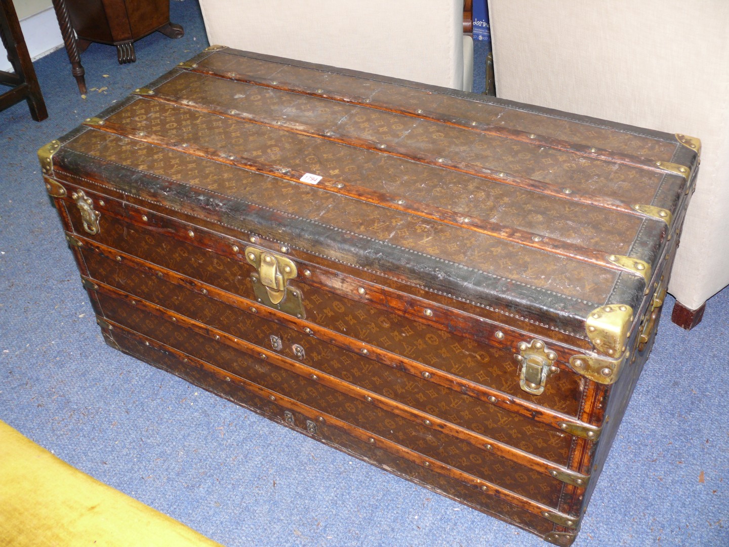 An early 20th century Louis Vuitton brass and leatherbound trunk, circa 1910, with allover repeat