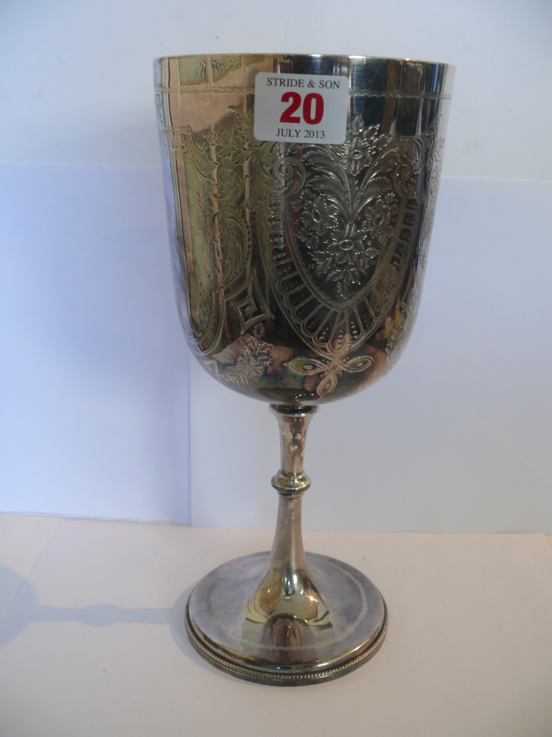 A large Victorian silver goblet on beaded pedestal foot and knopped stem, bowl engraved with