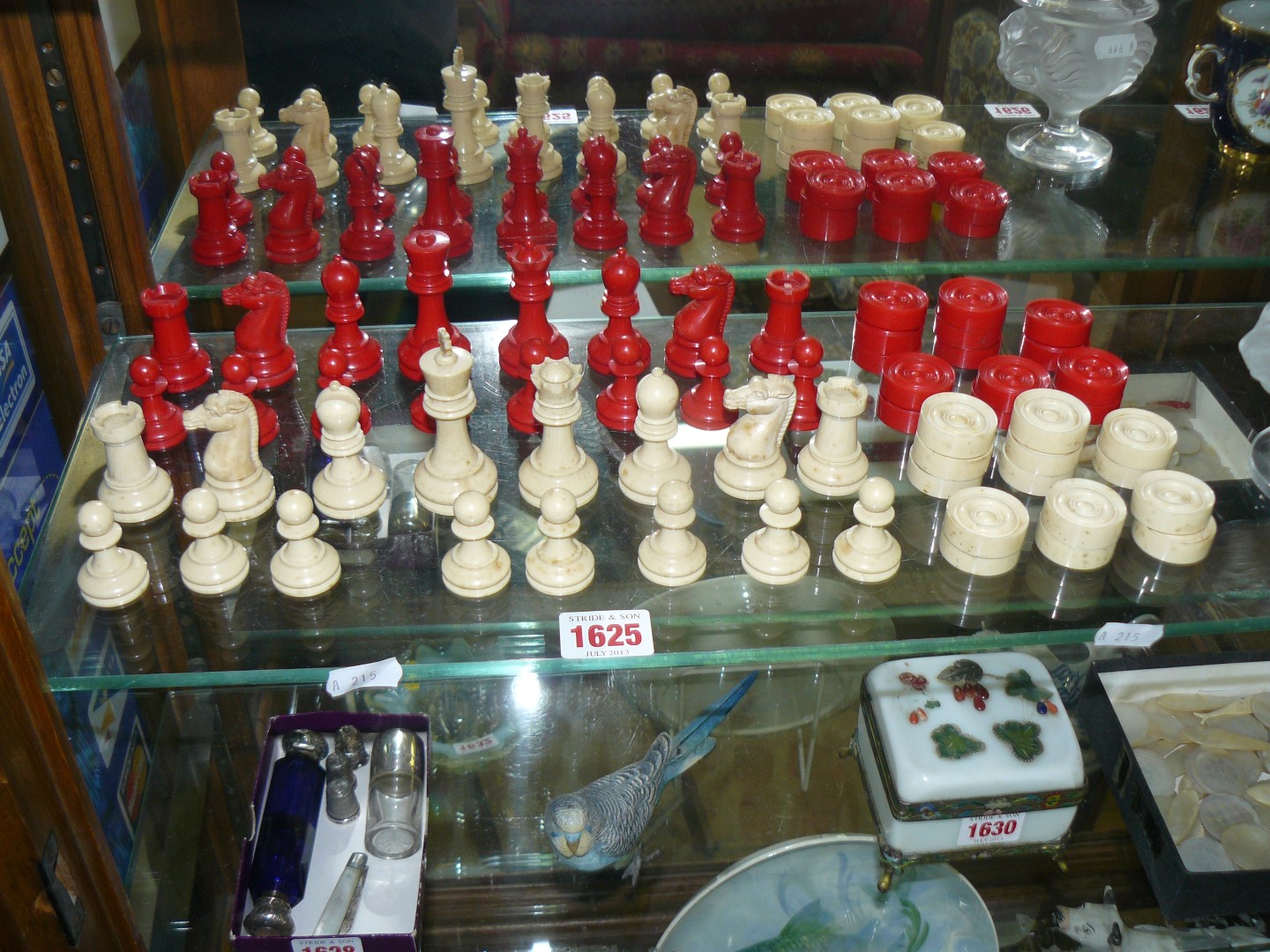 An ivory and celluloid Staunton pattern chess set, king 7.5cm high, pawn 4cm high; with matching