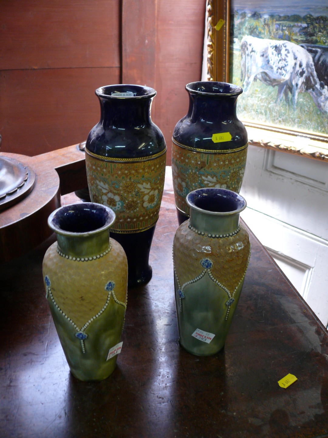Two pairs of Royal Doulton stoneware vases, largest 27.5cm high.