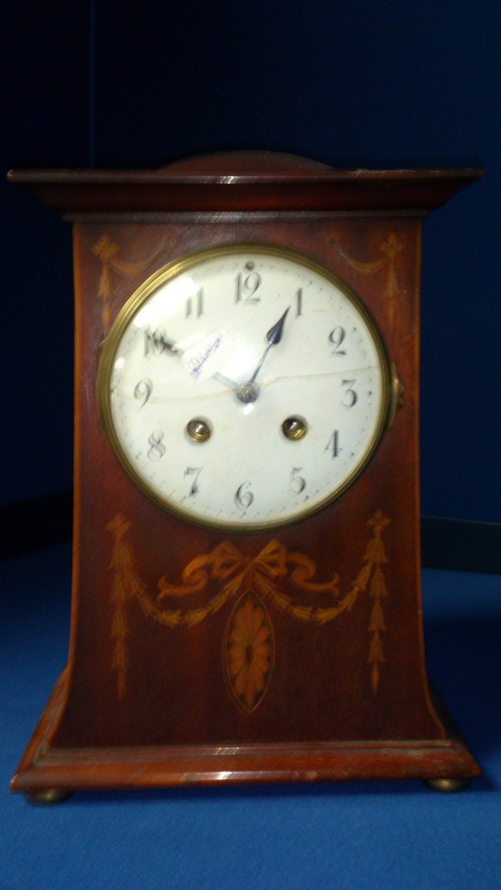 An Edwardian and inlaid mantle clock