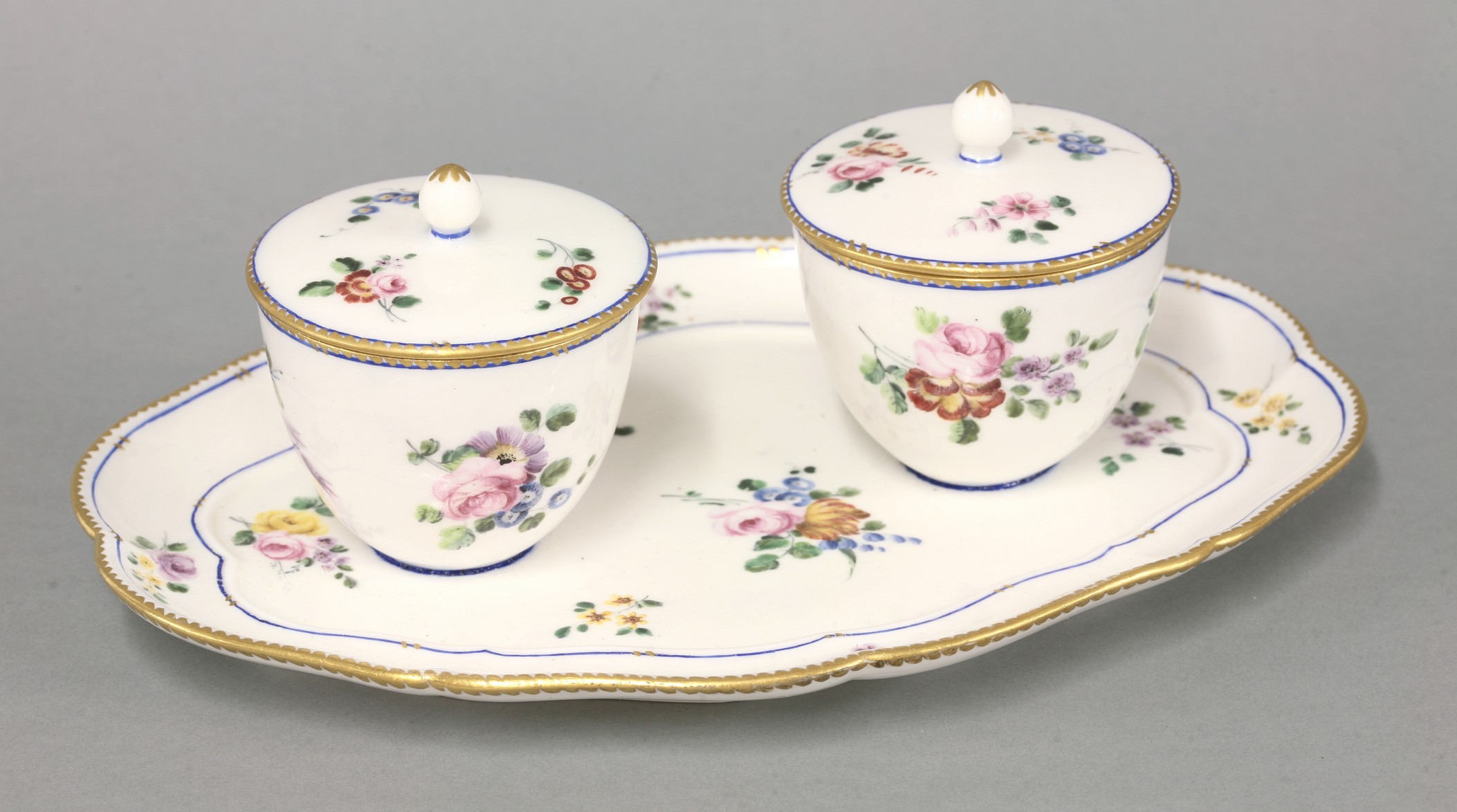 A Sèvres Confiture,
18th and 19th century, the lobed quatrefoil stand applied with two bowls and