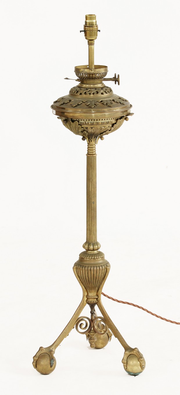 An extraordinary bronze table lamp,
late 19th century, the reservoir with applied mounts on a reeded