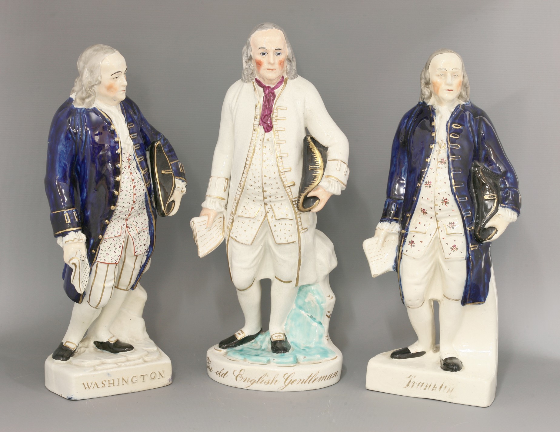 Three Staffordshire pottery figures,
c.1860, one of Washington and two of Franklin, each standing in