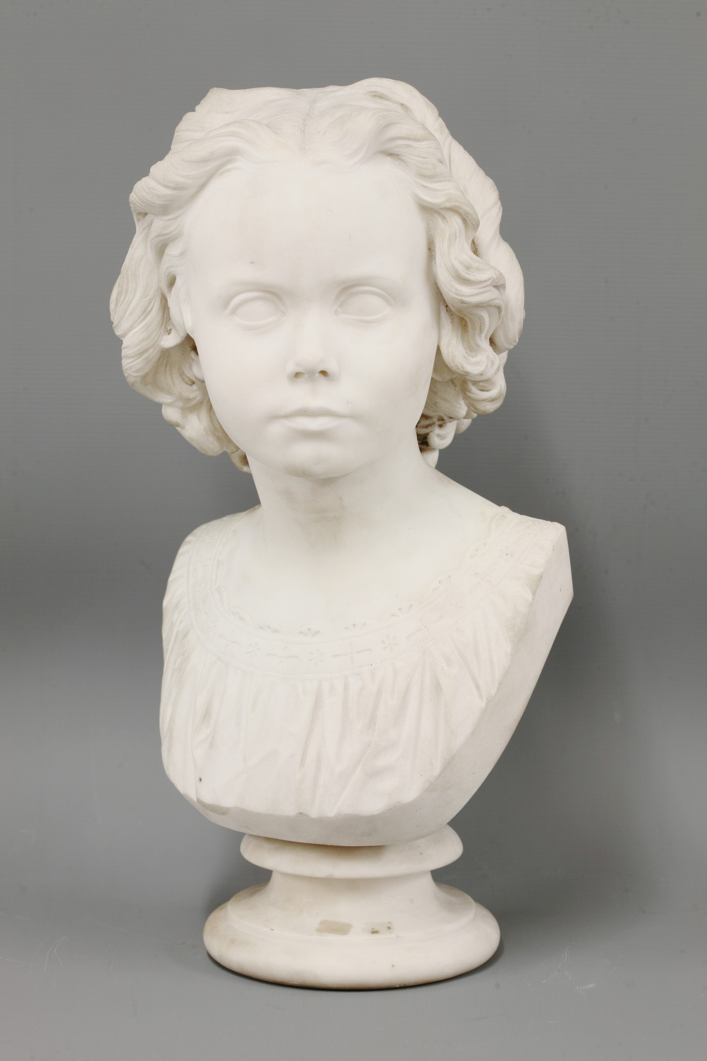 John Henry Foley RA (1818-1874),
a white marble bust of a girl, London 1863, the reverse