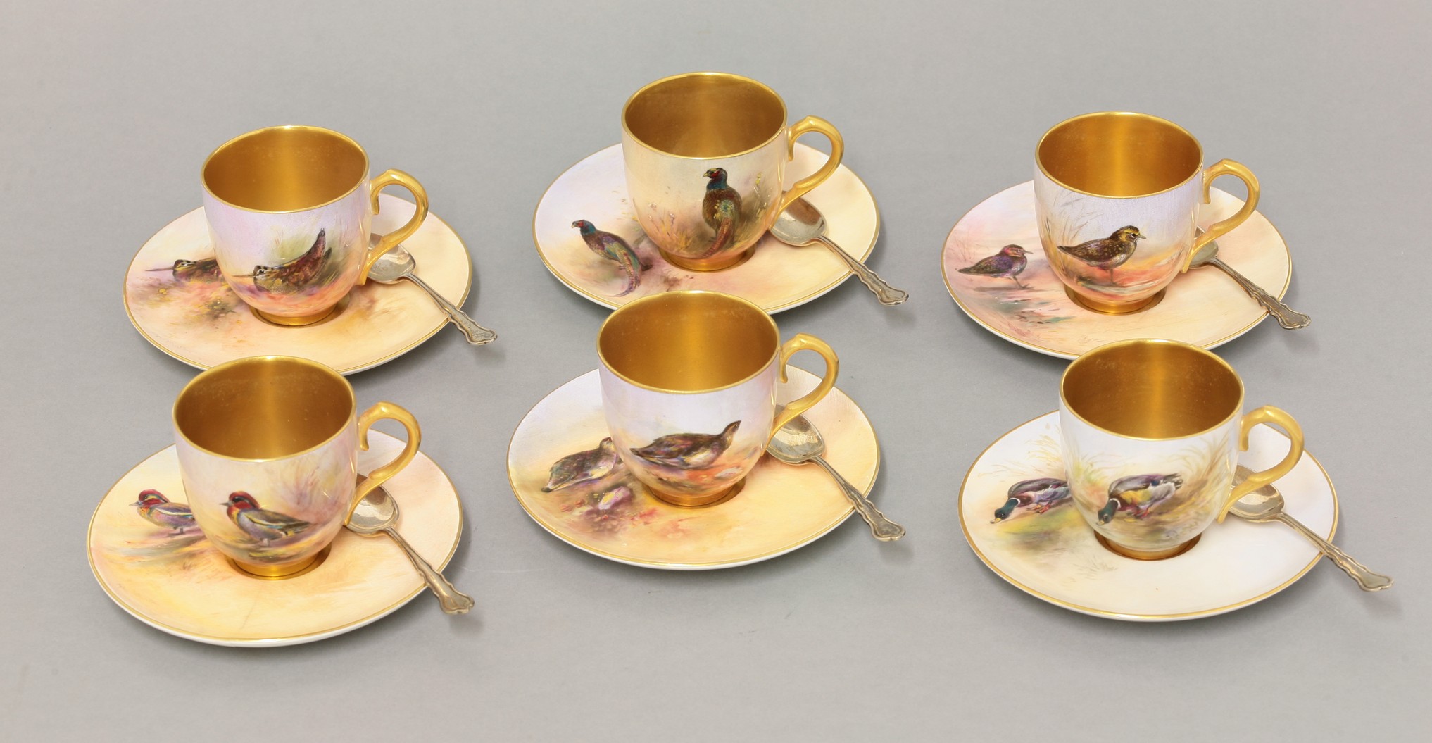 A Royal Worcester six-piece Coffee Set,
1938, each cup and saucer painted by J A Stinton with