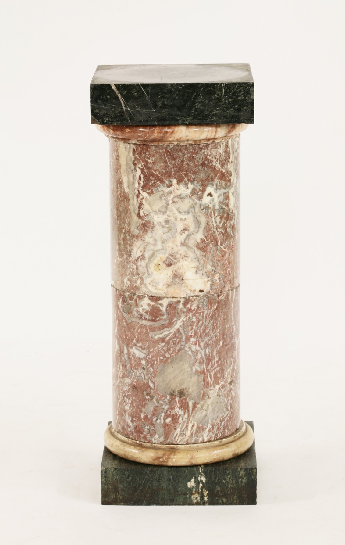 A cylindrical marble column,
with square base and top,
82cm high