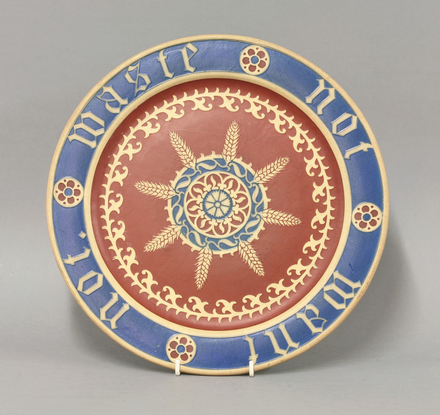 A Minton's encaustic Bread Plate,
designed by Augustus Welby Northmore Pugin, the rim inscribed '