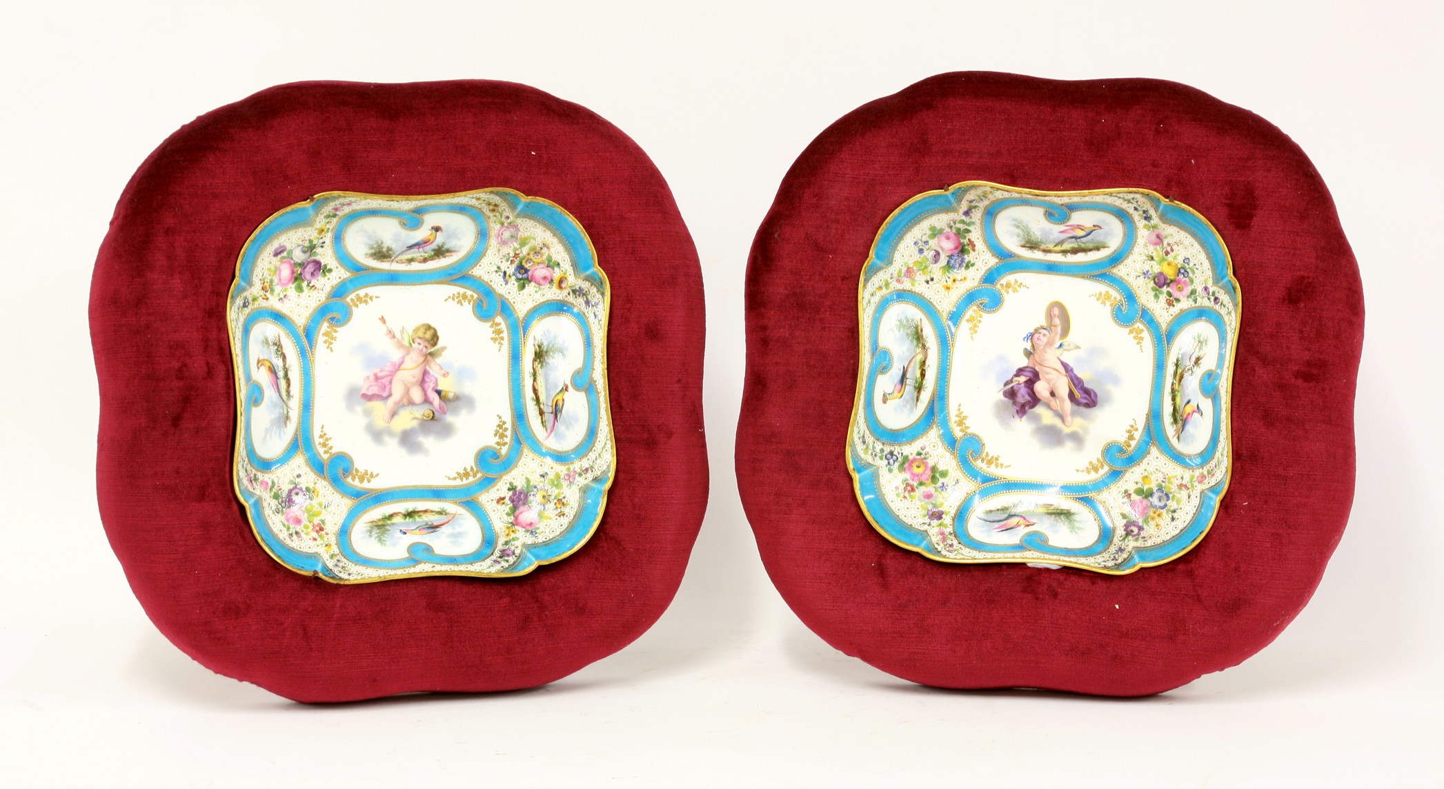 A pair of Sèvres-style notched square Dishes,
c.1835, each very well enamelled and gilt with a