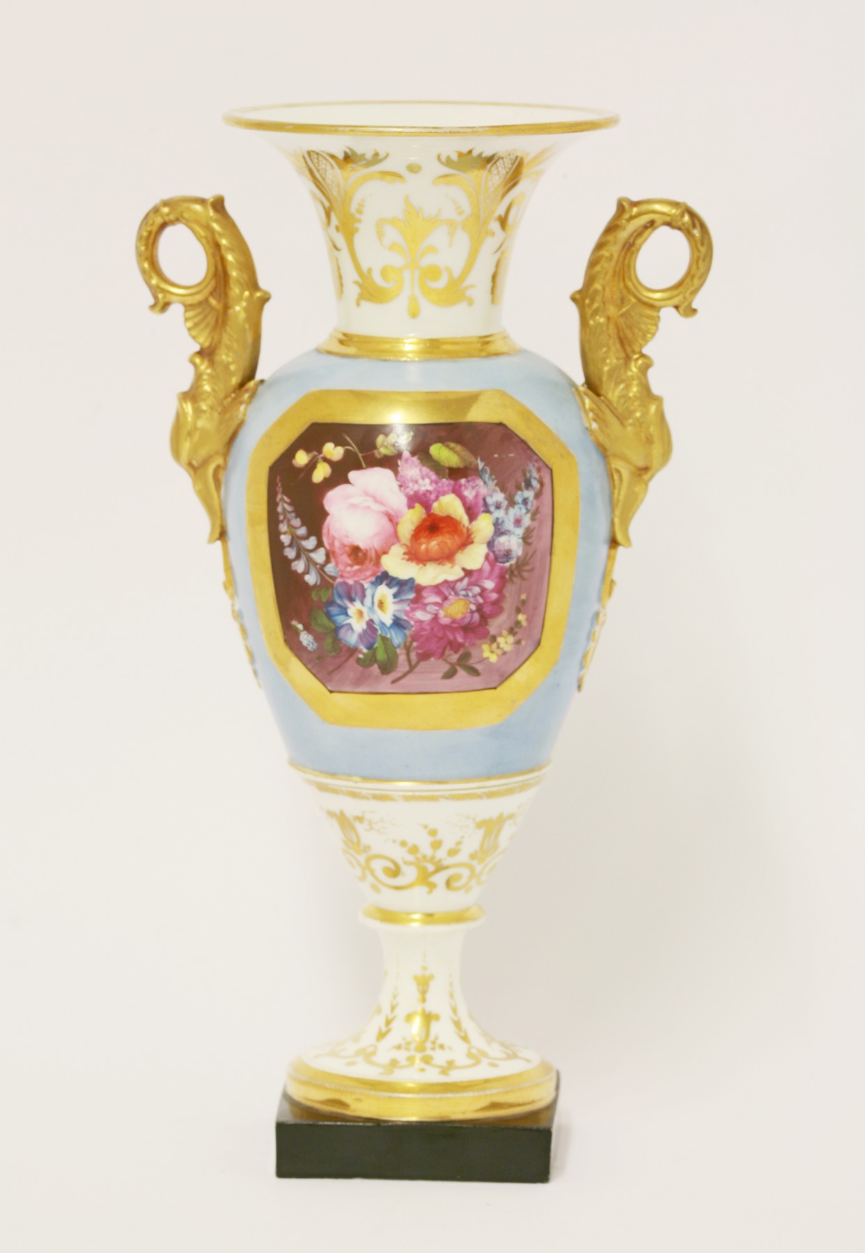 A Worcester Empire-style Vase,
c.1840, with gilt dolphin handles and a floral bouquet panel on a