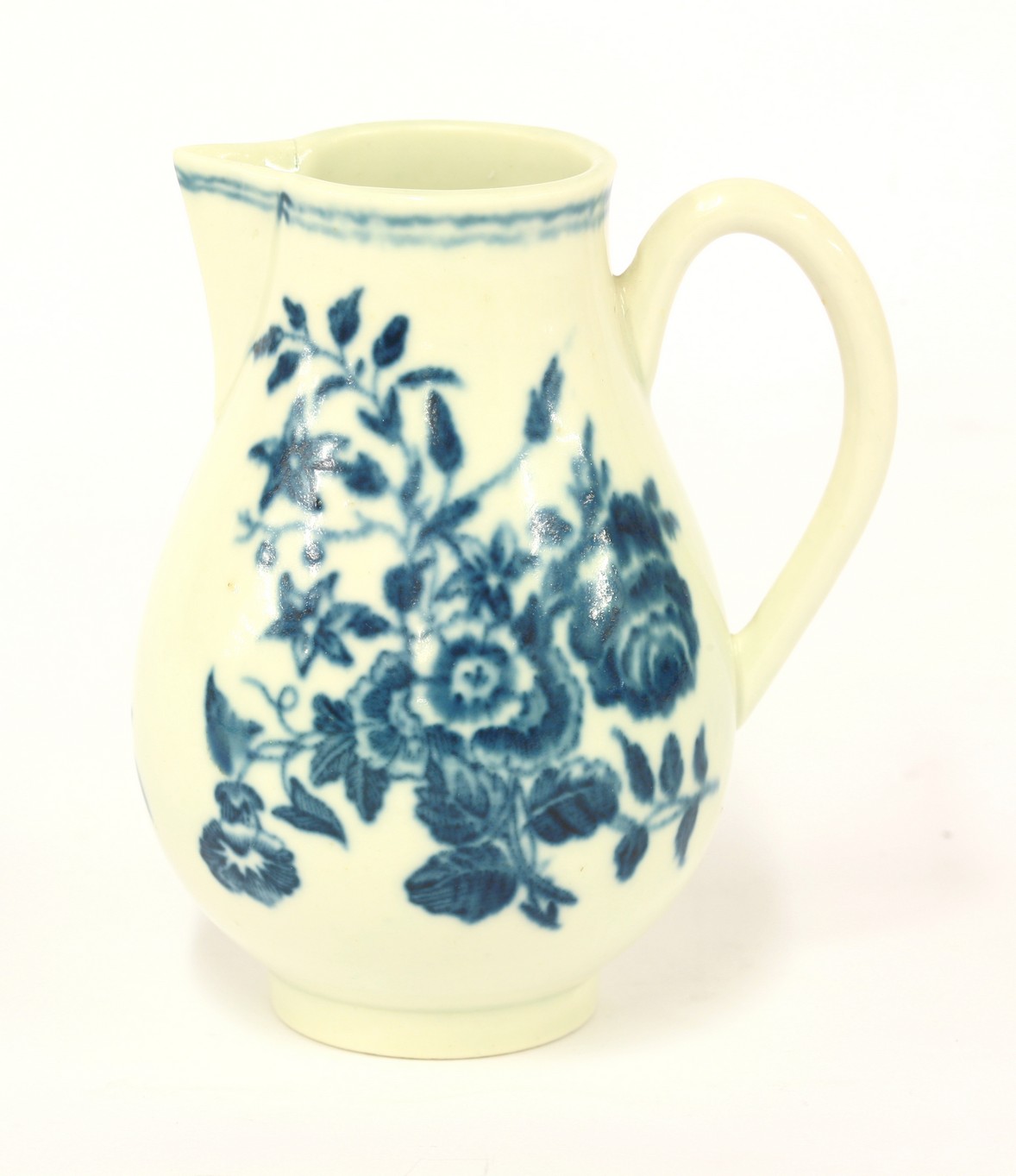 A Worcester sparrow-beak Milk Jug,
c.1775, printed in underglaze blue with butterflies and