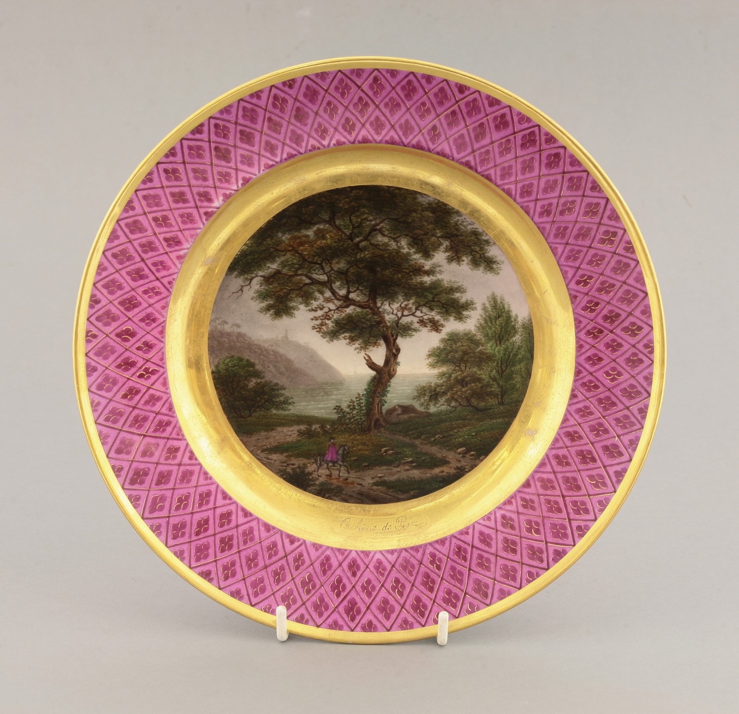 A Paris porcelain Plate,
c.1830, probably outside decorated with a bay entitled 'Cachine de Pise'