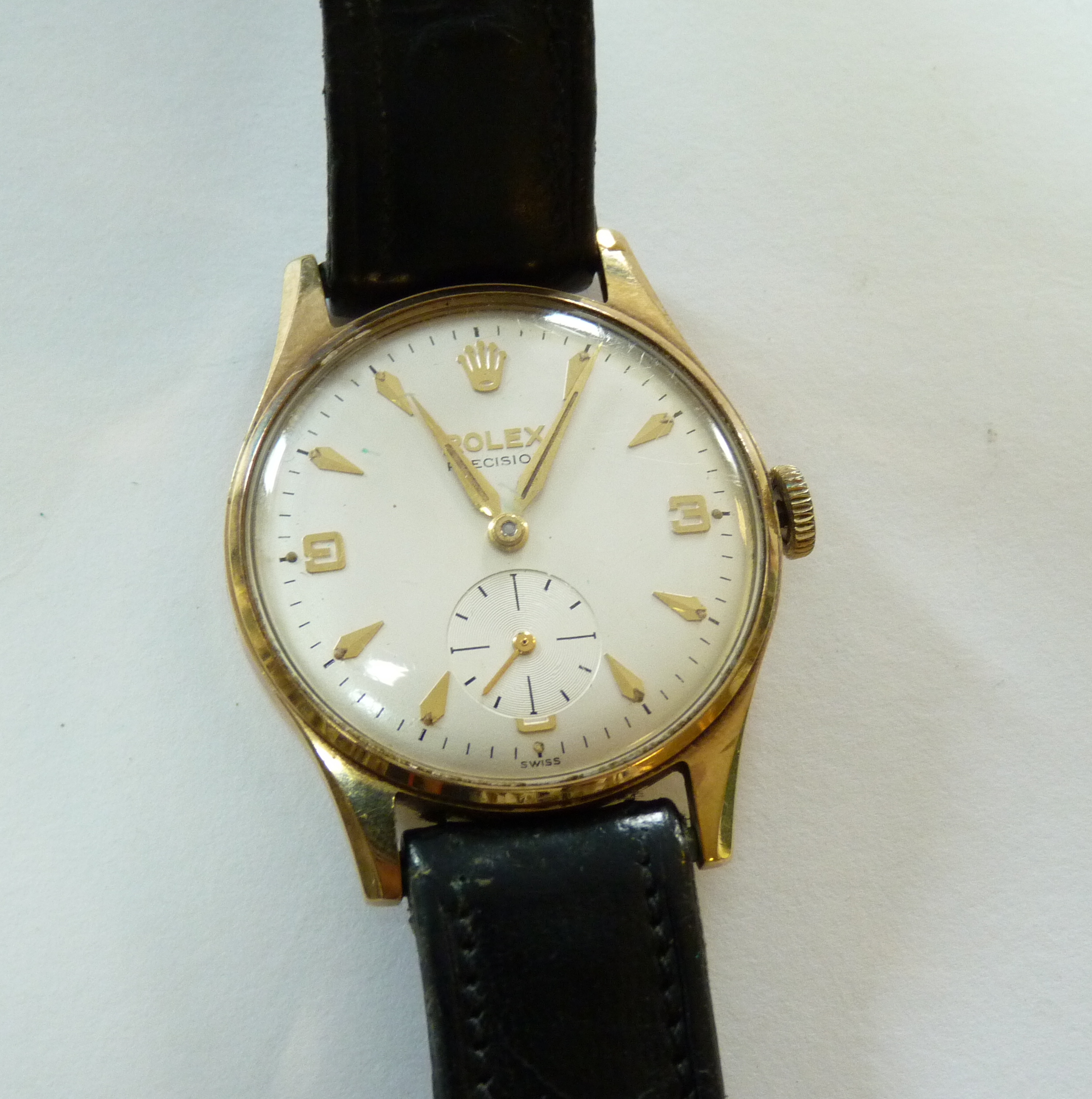 A gentleman`s 9ct gold Rolex Precision mechanical strap watch, model no 3042, with presentation