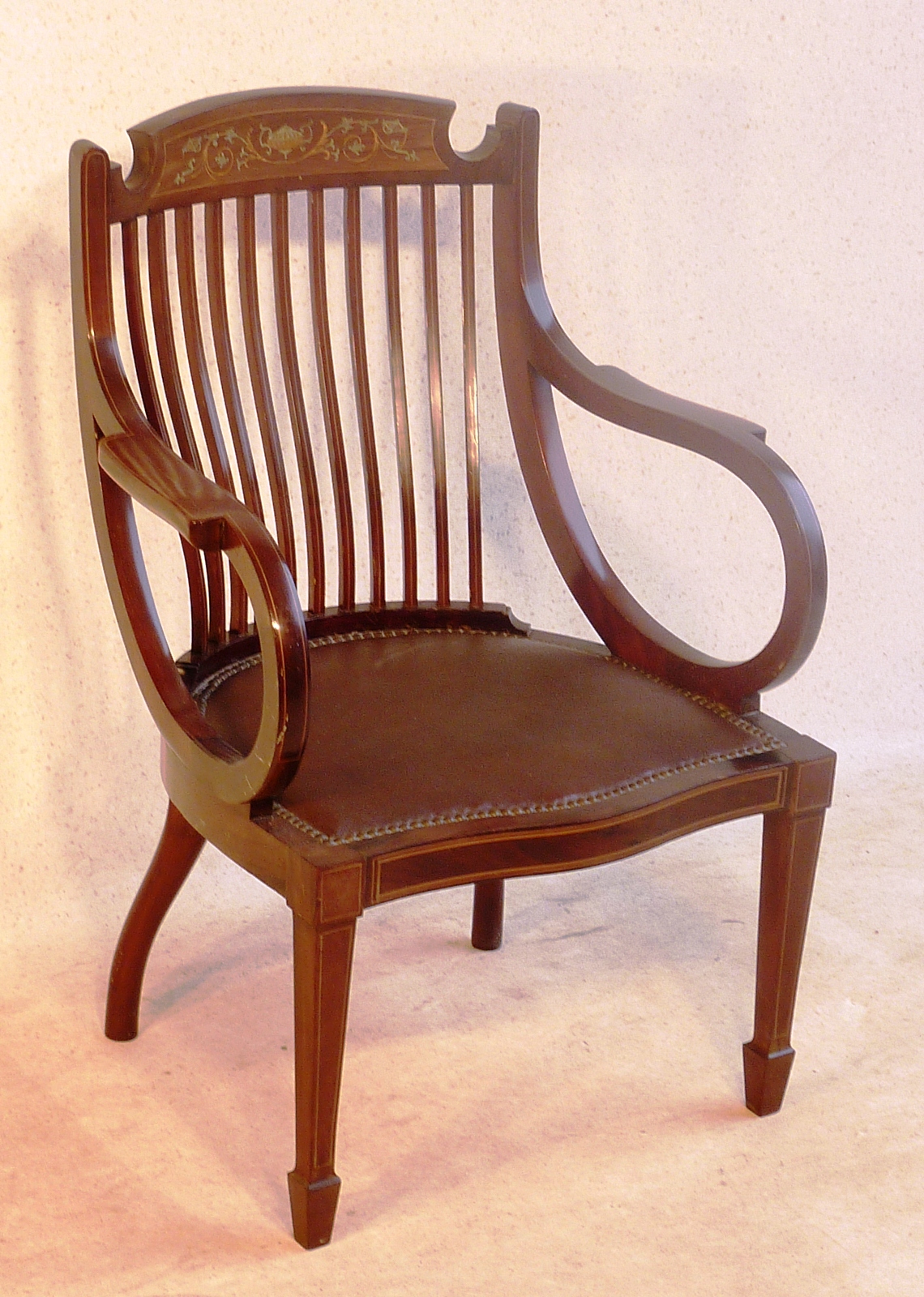 An Edwardian, mahogany and boxwood strung desk style Chair, the concave tablet shaped top rail