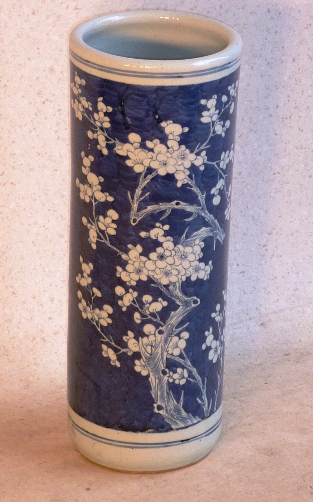 A Chinese porcelain Umbrella/Stick Stand, the underglaze blue decoration of flowering prunus against