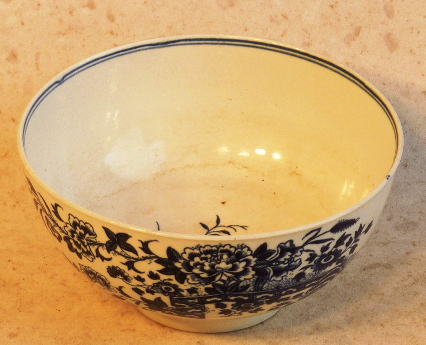 An 18th Century Worcester Bowl, the centre transfer decorated with a floral sprig, the outer body