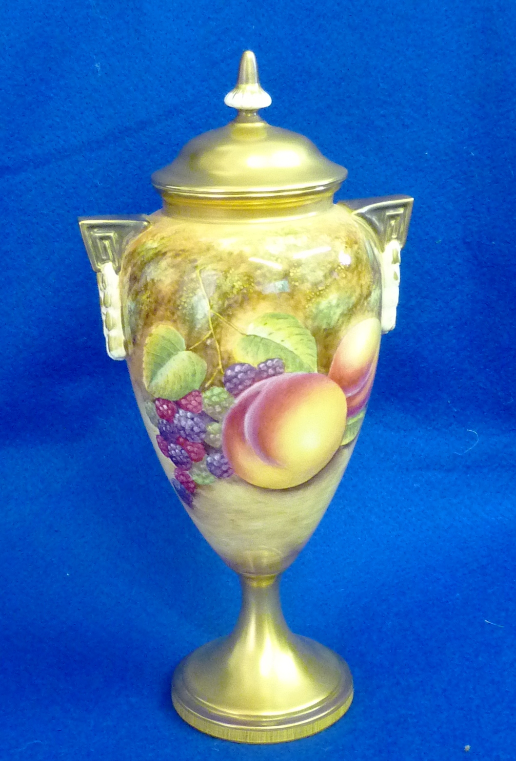 A 20th Century Royal Worcester fruit study pedestal Vase with lid signed S. Drysdale, No. 2713