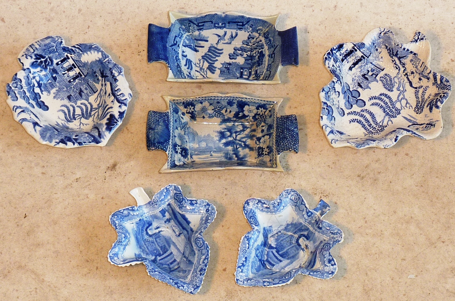 A selection of blue and white Pickle Dishes including a pair of late 18th/early 19th Century leaf