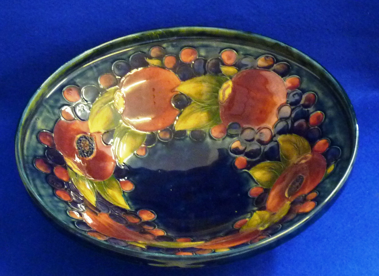 A large early 20th Century William Moorcroft circular footed Bowl, tube lined and decorated in the