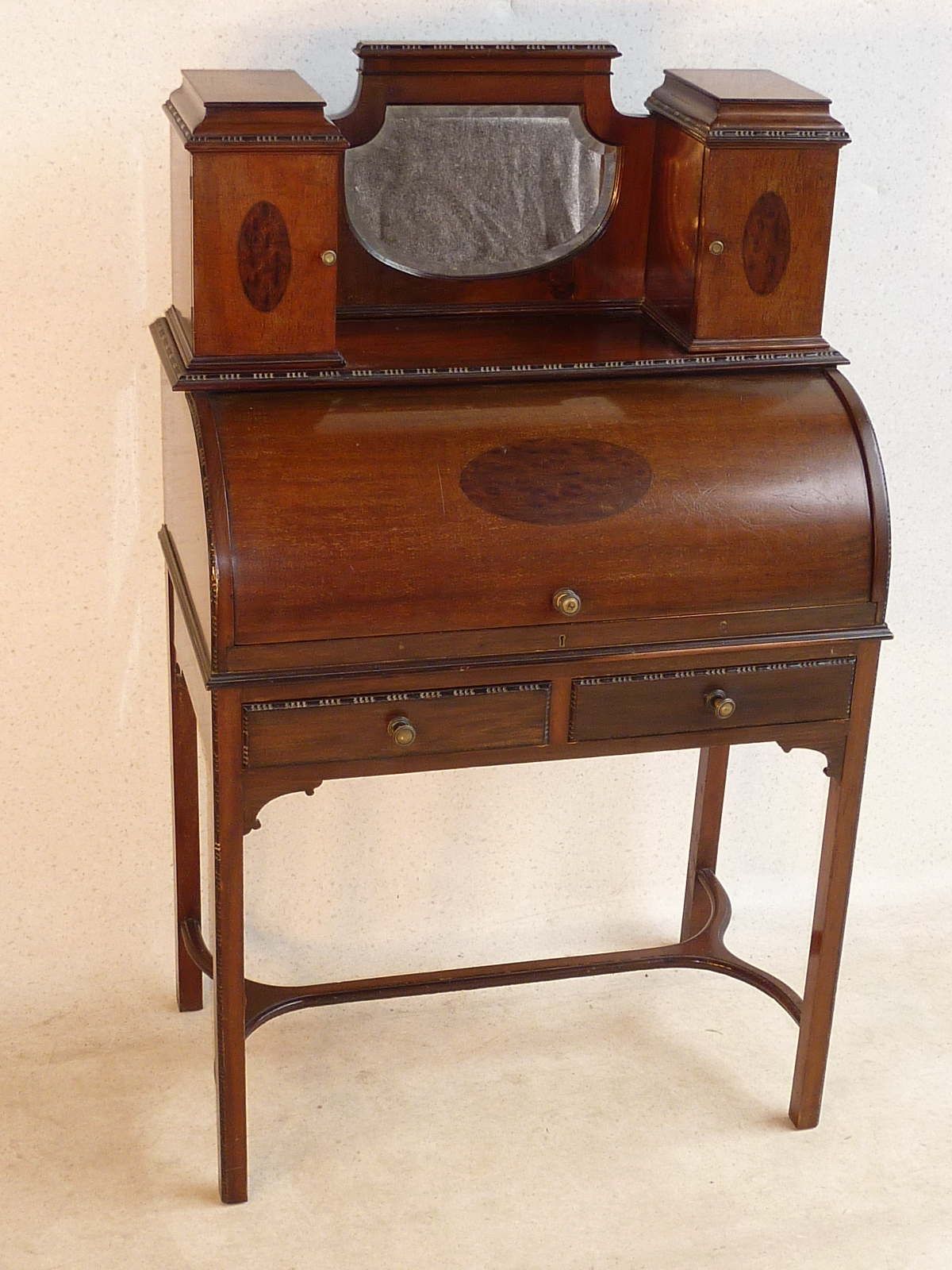 A good quality early 20th Century mahogany ladies mahogany inlaid roll top Desk, the