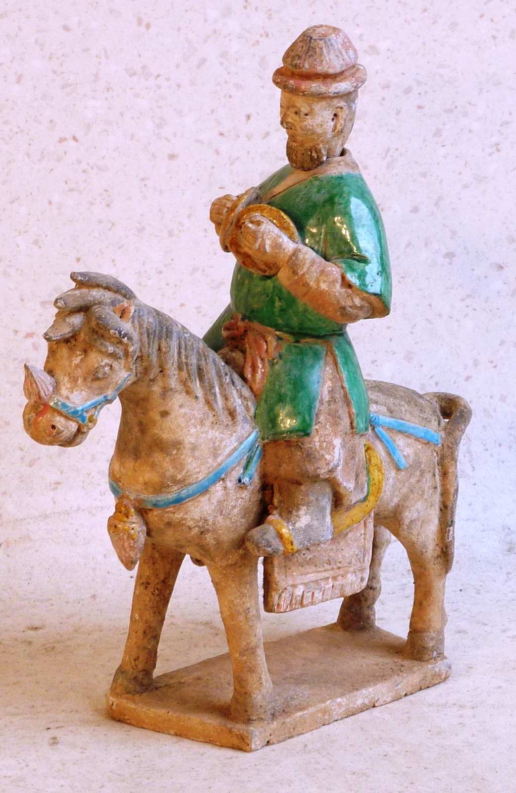 Ming Dynasty (1368-1644AD), a rare processional Horse and Rider, the figure dressed in asparagus