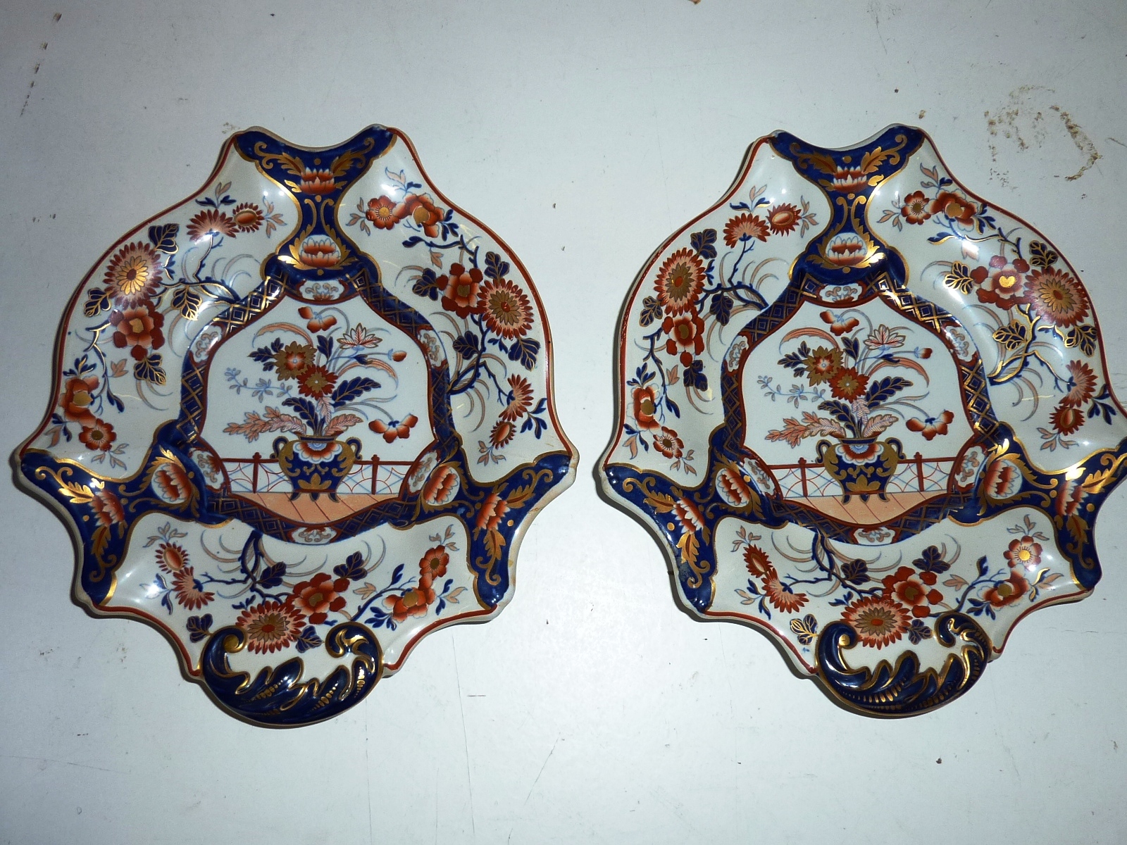 A pair of mid 19th Century iron stone Dishes hand gilded and decorated in the Imari palette with